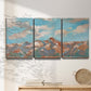 Three-panel canvas wall art featuring soft pastel western hills landscape, displayed in a minimalist living room above a console table.