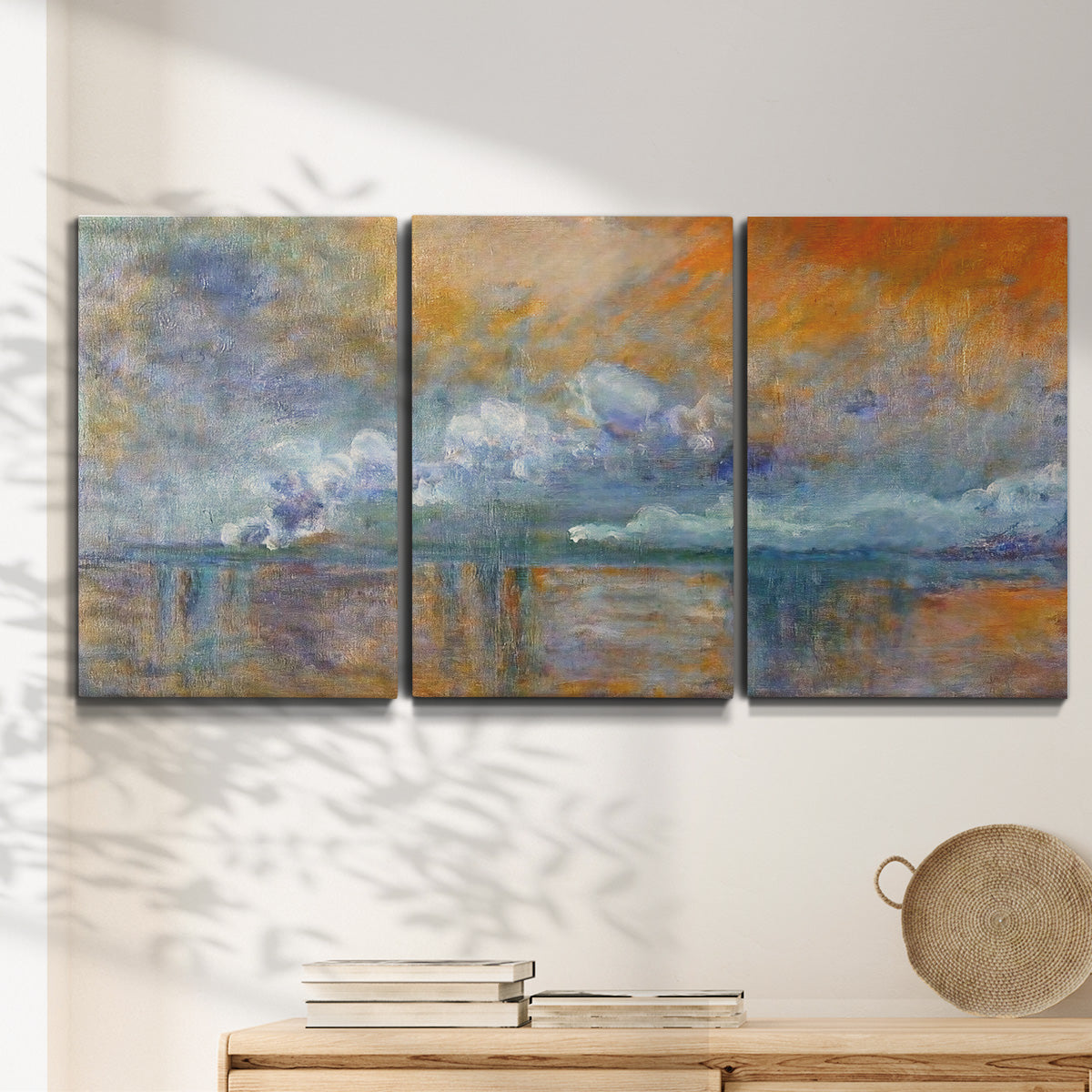 Three-panel canvas wall art featuring bridge shrouded in fog and smoke, displayed in a minimalist living room above a console table.