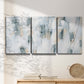 Three-panel canvas wall art featuring industrial textured abstract hatch patterns, displayed in a minimalist living room above a console table.
