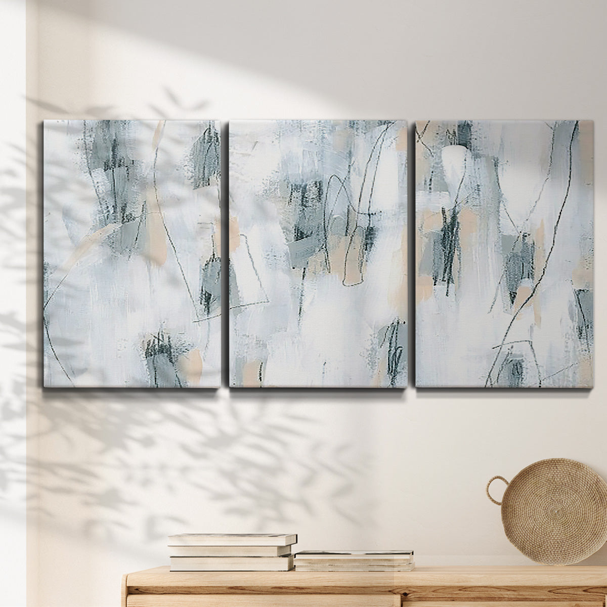 Three-panel canvas wall art featuring industrial textured abstract hatch patterns, displayed in a minimalist living room above a console table.