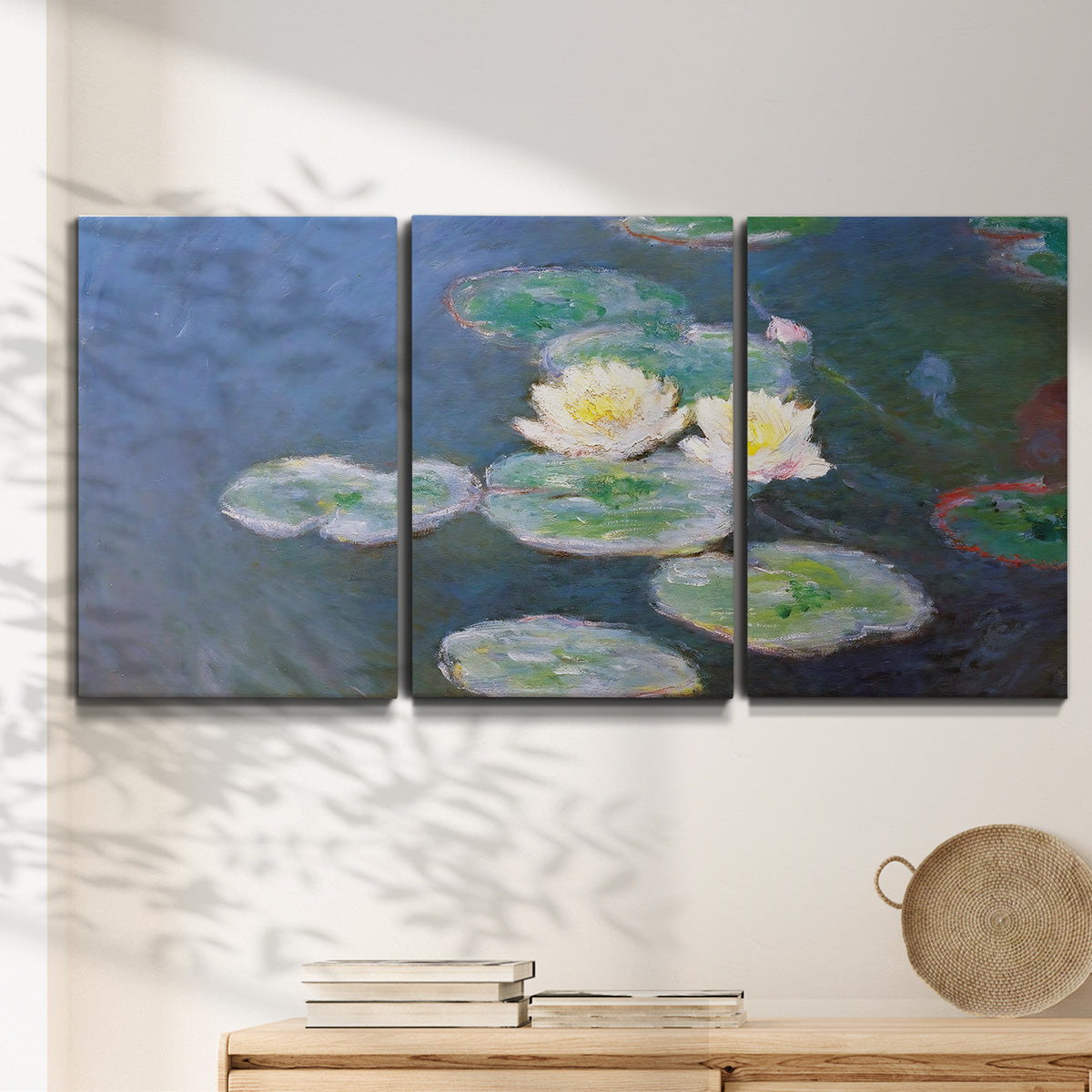 Three-panel canvas wall art featuring water lilies floating on pond, displayed in a minimalist living room above a console table.