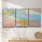Three-panel canvas wall art featuring geometric mid century abstract blocks, displayed in a minimalist living room above a console table.