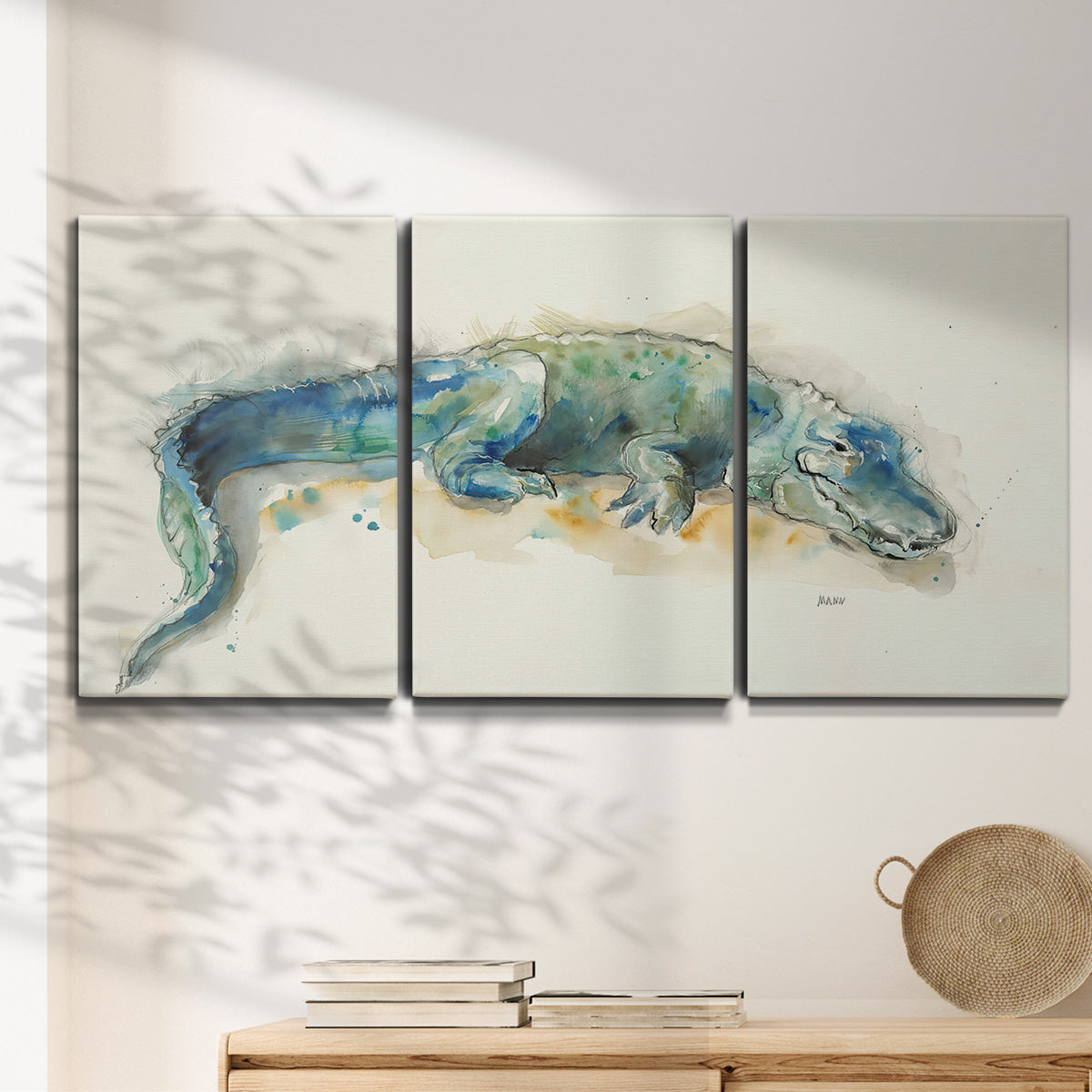 Three-panel canvas wall art featuring alligator illustrated wildlife portrait, displayed in a minimalist living room above a console table.