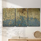 Three-panel canvas wall art featuring metallic abstract gold tones, displayed in a minimalist living room above a console table.