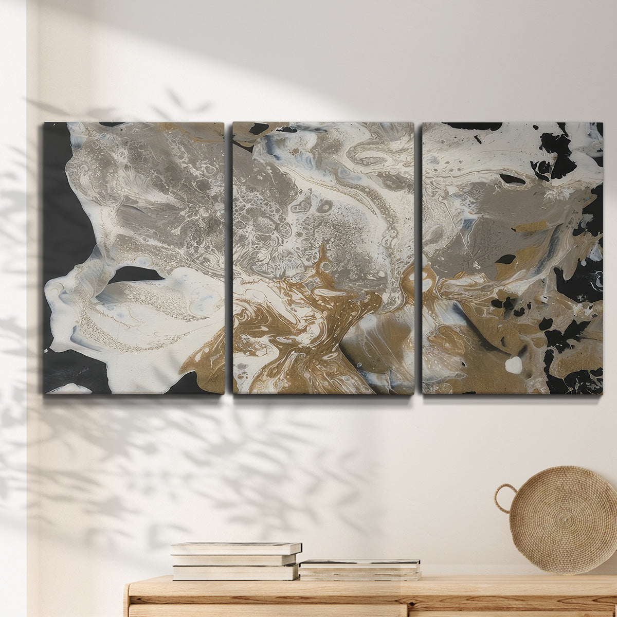 Three-panel canvas wall art featuring pale abstract mask like forms, displayed in a minimalist living room above a console table.