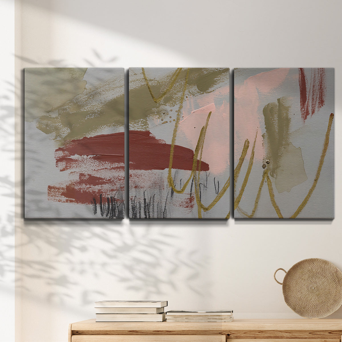 Three-panel canvas wall art featuring minimalist abstract line textures, displayed in a minimalist living room above a console table.