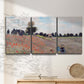 Three-panel canvas wall art featuring poppy field stretching across meadow, displayed in a minimalist living room above a console table.