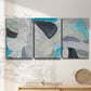 Three-panel canvas wall art featuring subtle abstract billowing color layers, displayed in a minimalist living room above a console table.