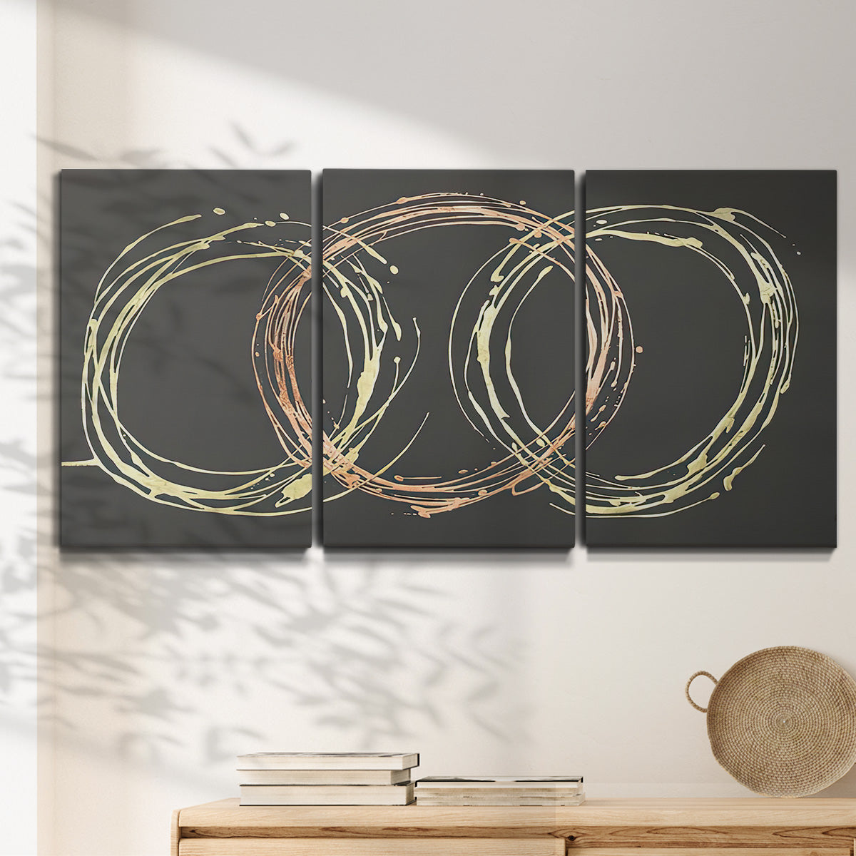 Three-panel canvas wall art featuring geometric abstract wave tangents, displayed in a minimalist living room above a console table.