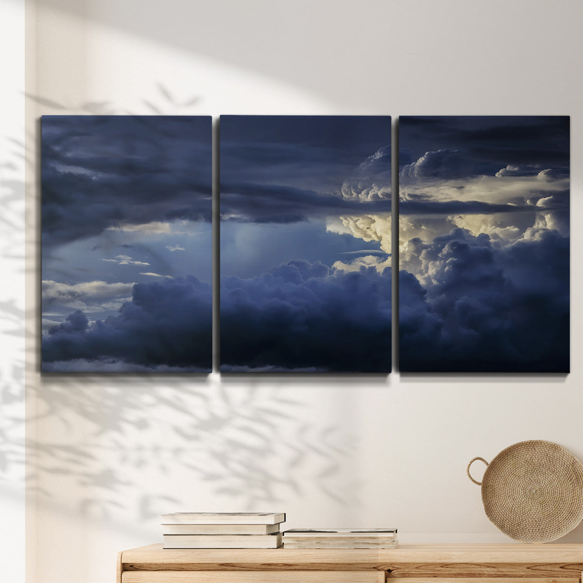 Three-panel canvas wall art featuring hot air balloons rising at dawn, displayed in a minimalist living room above a console table.