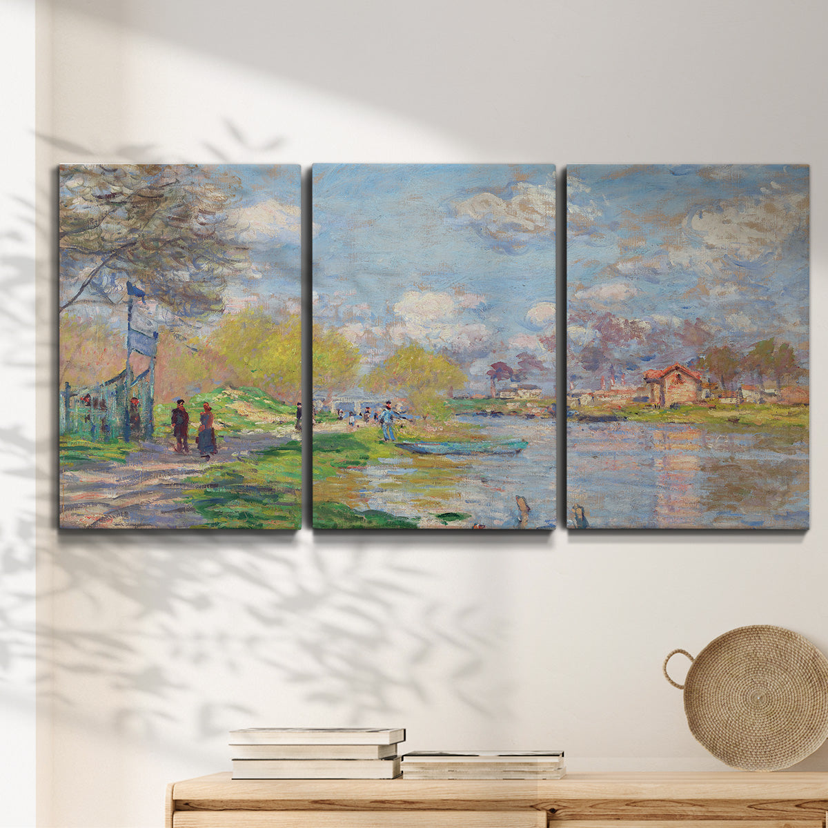 Three-panel canvas wall art featuring formal city park with trees, displayed in a minimalist living room above a console table.