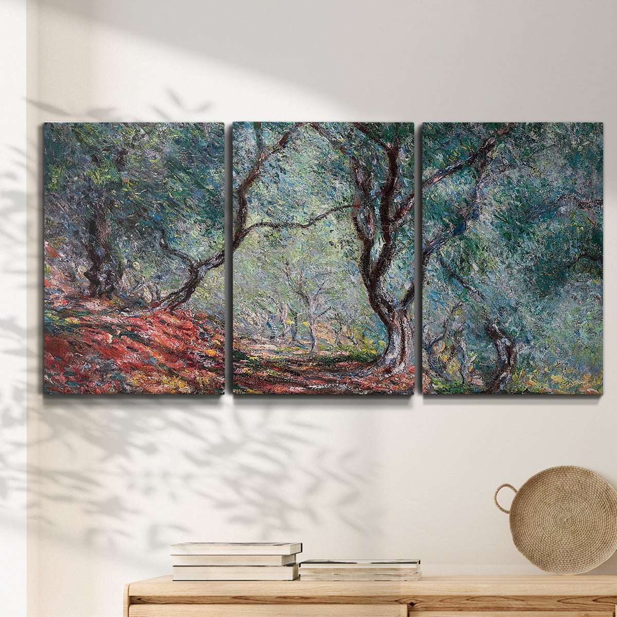 Three-panel canvas wall art featuring olive trees in sunlit garden, displayed in a minimalist living room above a console table.