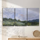 Three-panel canvas wall art featuring wide open pastoral horizon landscape, displayed in a minimalist living room above a console table.