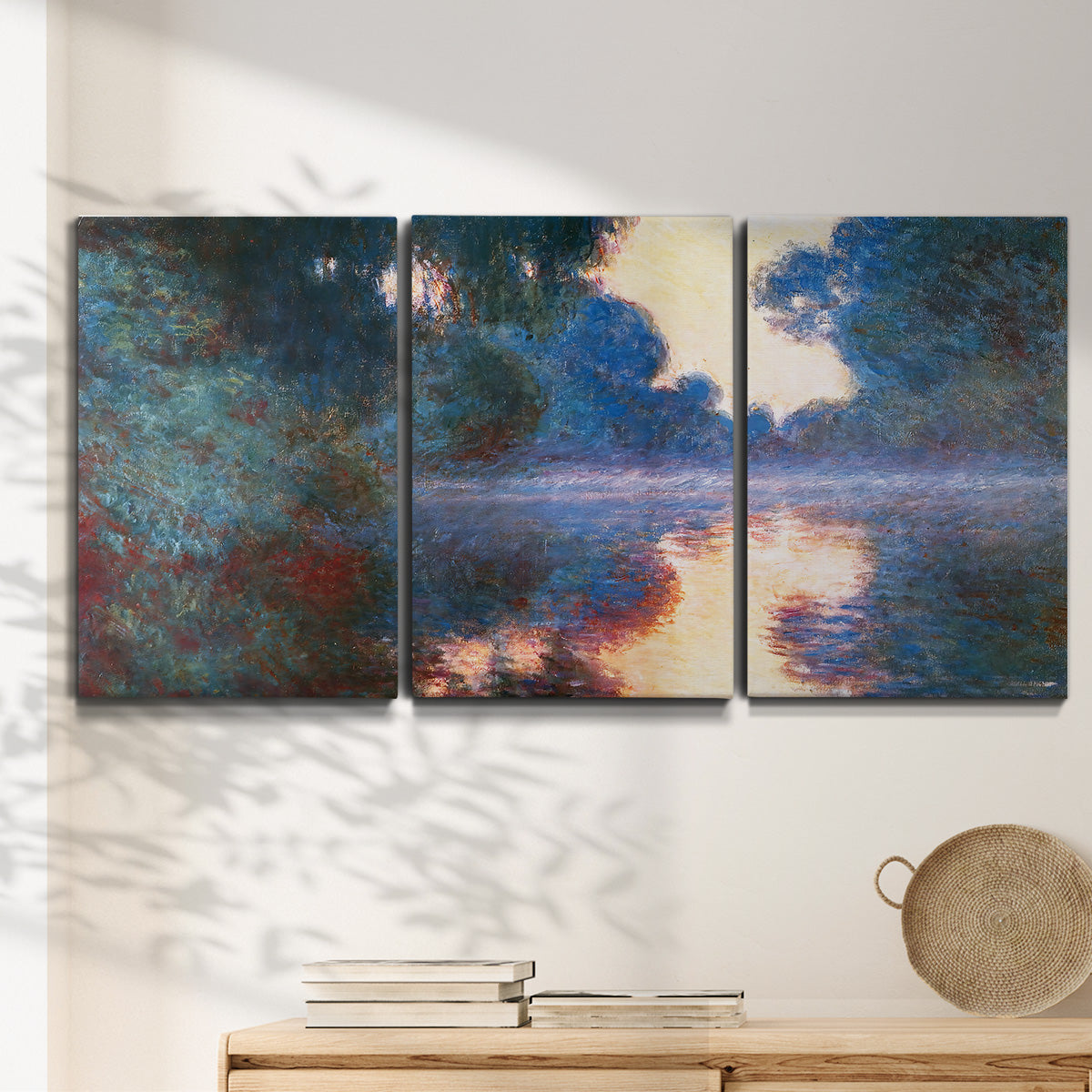 Three-panel canvas wall art featuring misty river surface at dawn, displayed in a minimalist living room above a console table.