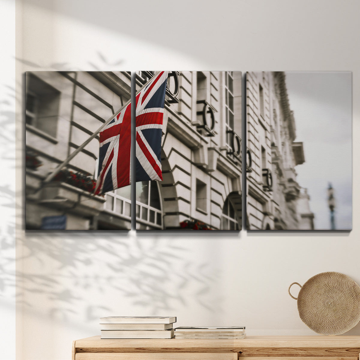 Three-panel canvas wall art featuring london street scene photograph, displayed in a minimalist living room above a console table.