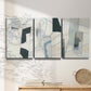 Three-panel canvas wall art featuring interwoven icy abstract linear forms, displayed in a minimalist living room above a console table.