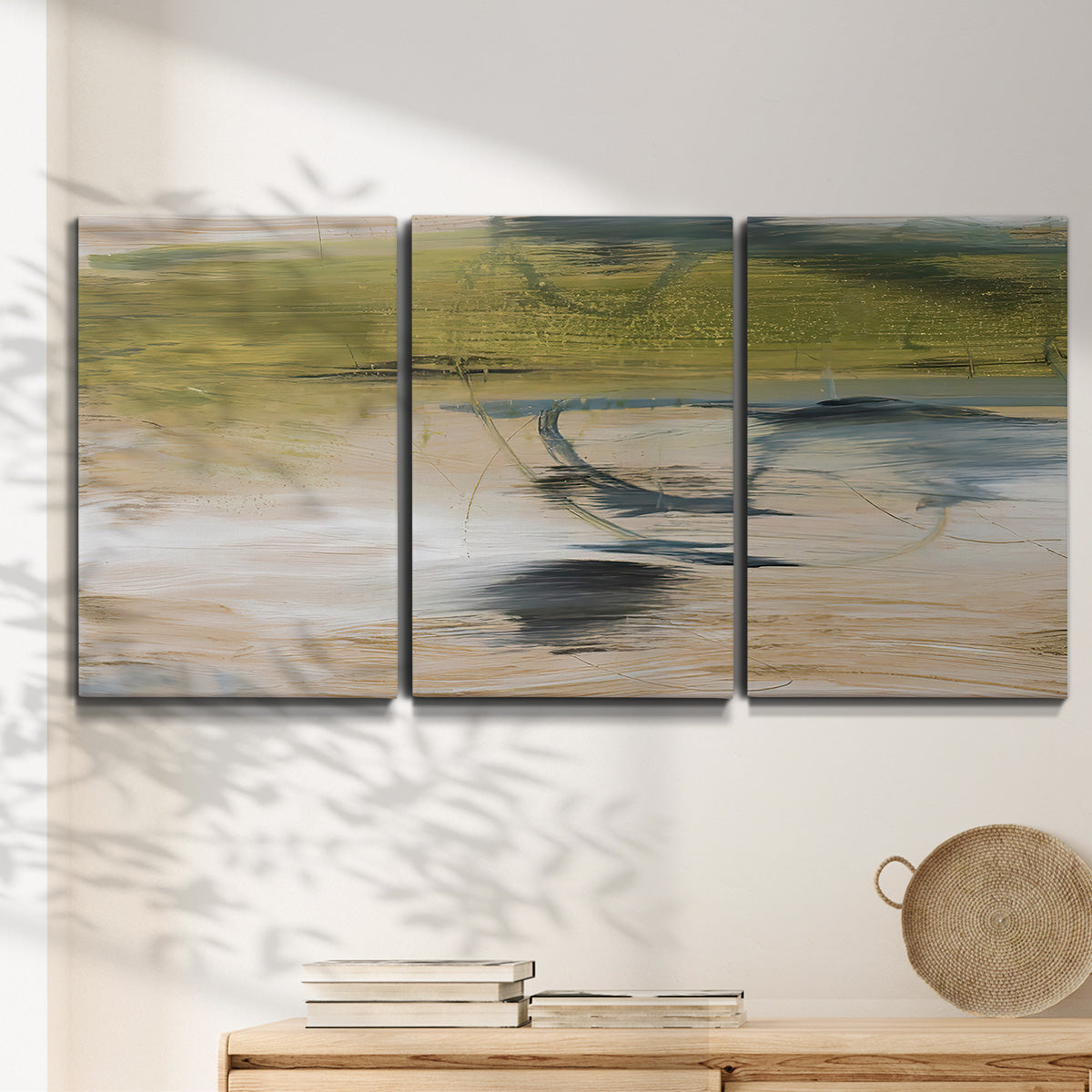 Three-panel canvas wall art featuring minimal abstract water reflections, displayed in a minimalist living room above a console table.