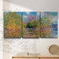 Three-panel canvas wall art featuring wide river landscape, displayed in a minimalist living room above a console table.