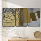 Three-panel canvas wall art featuring industrial abstract digital glitch pattern, displayed in a minimalist living room above a console table.