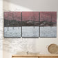 Three-panel canvas wall art featuring winter sunset snowfall landscape, displayed in a minimalist living room above a console table.