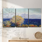 Three-panel canvas wall art featuring mediterranean coastline with headland, displayed in a minimalist living room above a console table.