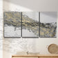 Three-panel canvas wall art featuring light modern abstract wind patterns, displayed in a minimalist living room above a console table.