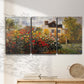 Three-panel canvas wall art featuring farm buildings in rural normandy, displayed in a minimalist living room above a console table.