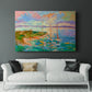 Colorful seascape with boats and vibrant skies over a coastal landscape in late afternoon light