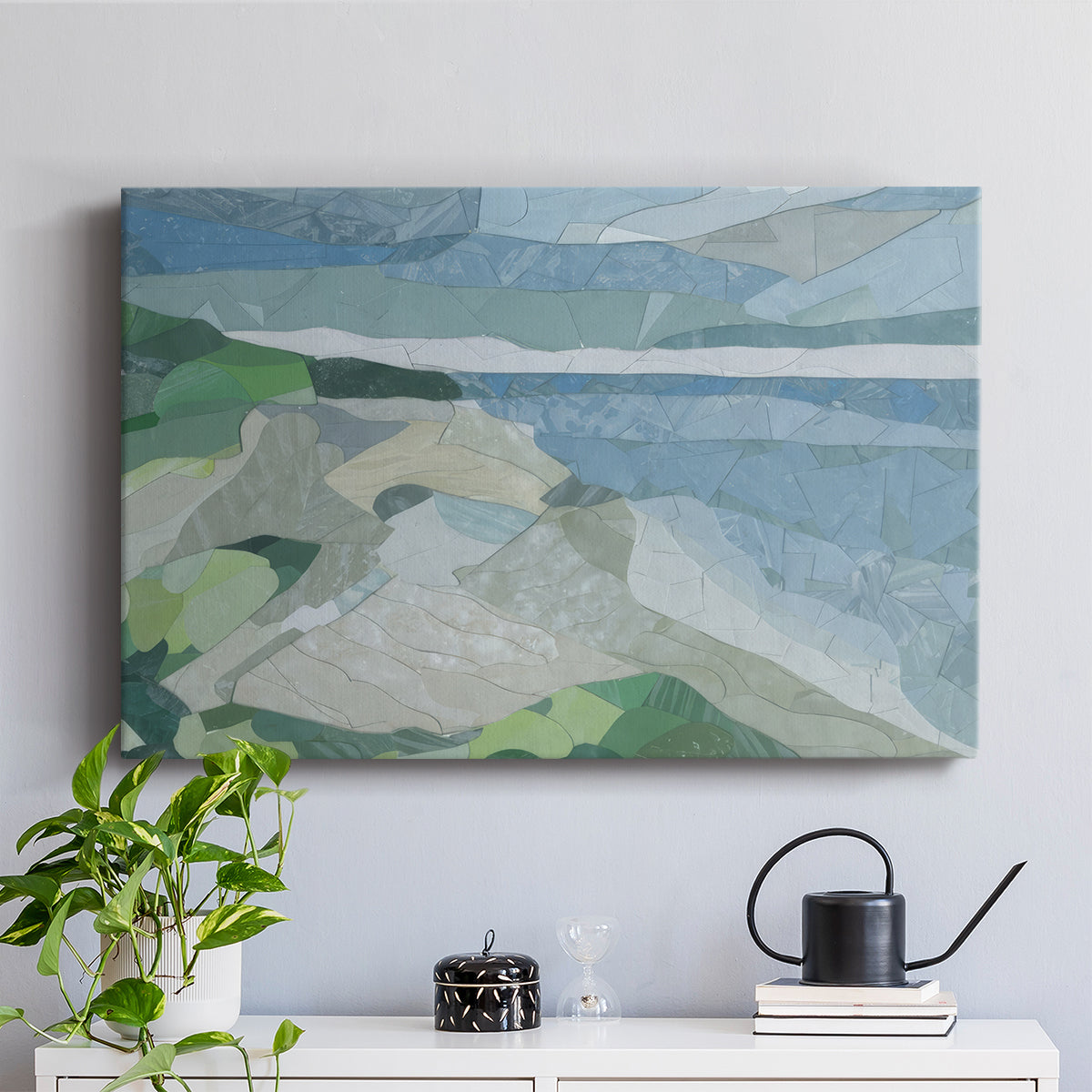 Colorful geometric landscape artwork depicting a coastal view with blue waters and green hills during daytime