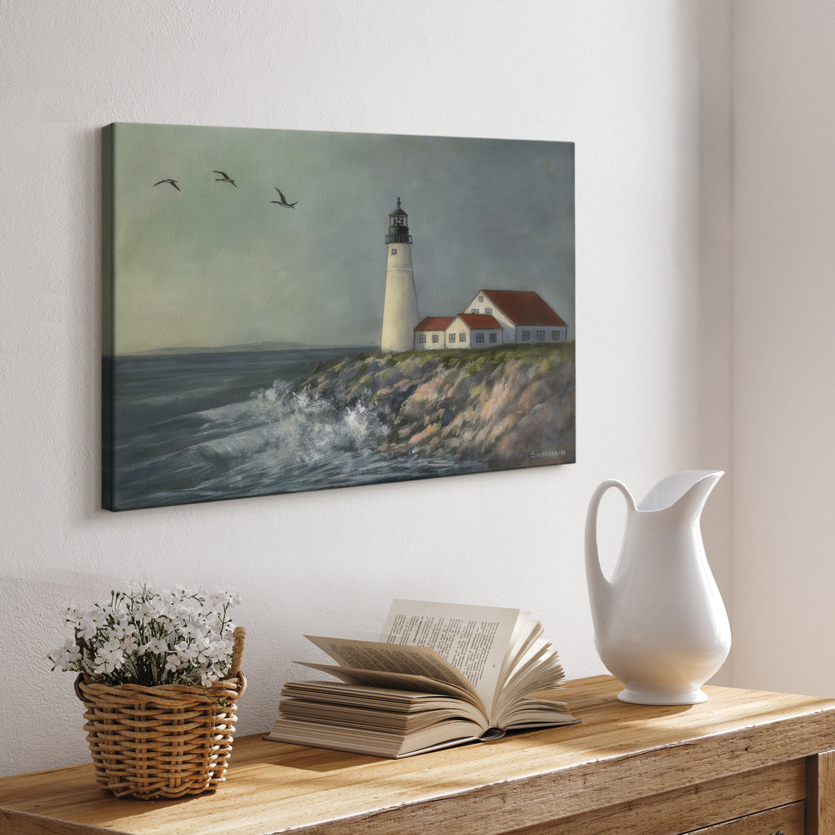 Lighthouse stands tall against crashing waves at a coastal location with birds flying overhead during a calm day