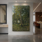 Canvas art print of a realistic landscape of a forest entrance with tall trees and soft light displayed as a statement piece in a spacious interior.