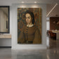 Canvas art print of a realistic portrait of a woman with soft tones and composed expression displayed as a statement piece in a spacious interior.