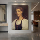 Canvas art print of a classical portrait of a young woman with soft features and warm tones displayed as a statement piece in a spacious interior.