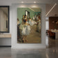 Canvas art print of an impressionist scene of ballet dancers practicing in a studio displayed as a statement piece in a spacious interior.