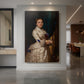 Canvas art print of a realistic portrait of a woman with gentle expression and muted tones displayed as a statement piece in a spacious interior.