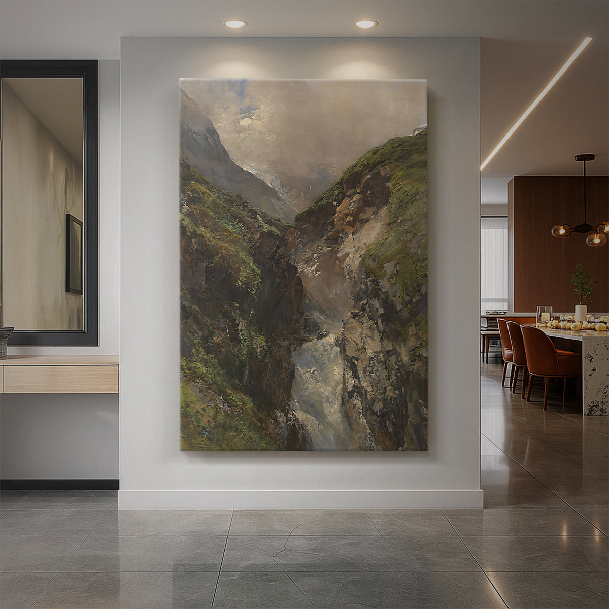 Canvas art print of a dramatic mountain gorge with a cascading waterfall and rugged rock formations displayed as a statement piece in a spacious interior.
