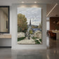 Canvas art print of an impressionist street scene with houses and figures under soft daylight displayed as a statement piece in a spacious interior.