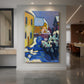 Canvas art print of an expressionist landscape of buildings in a snowy setting with bold color displayed as a statement piece in a spacious interior.