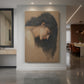 Canvas art print of a symbolic study of a female head with soft features and muted tones displayed as a statement piece in a spacious interior.