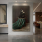 Canvas art print of an impressionist portrait of a woman in a green dress with rich flowing fabric displayed as a statement piece in a spacious interior.