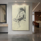 Canvas art print of a figure study of a seated male nude wearing a hat in soft pencil lines displayed as a statement piece in a spacious interior.