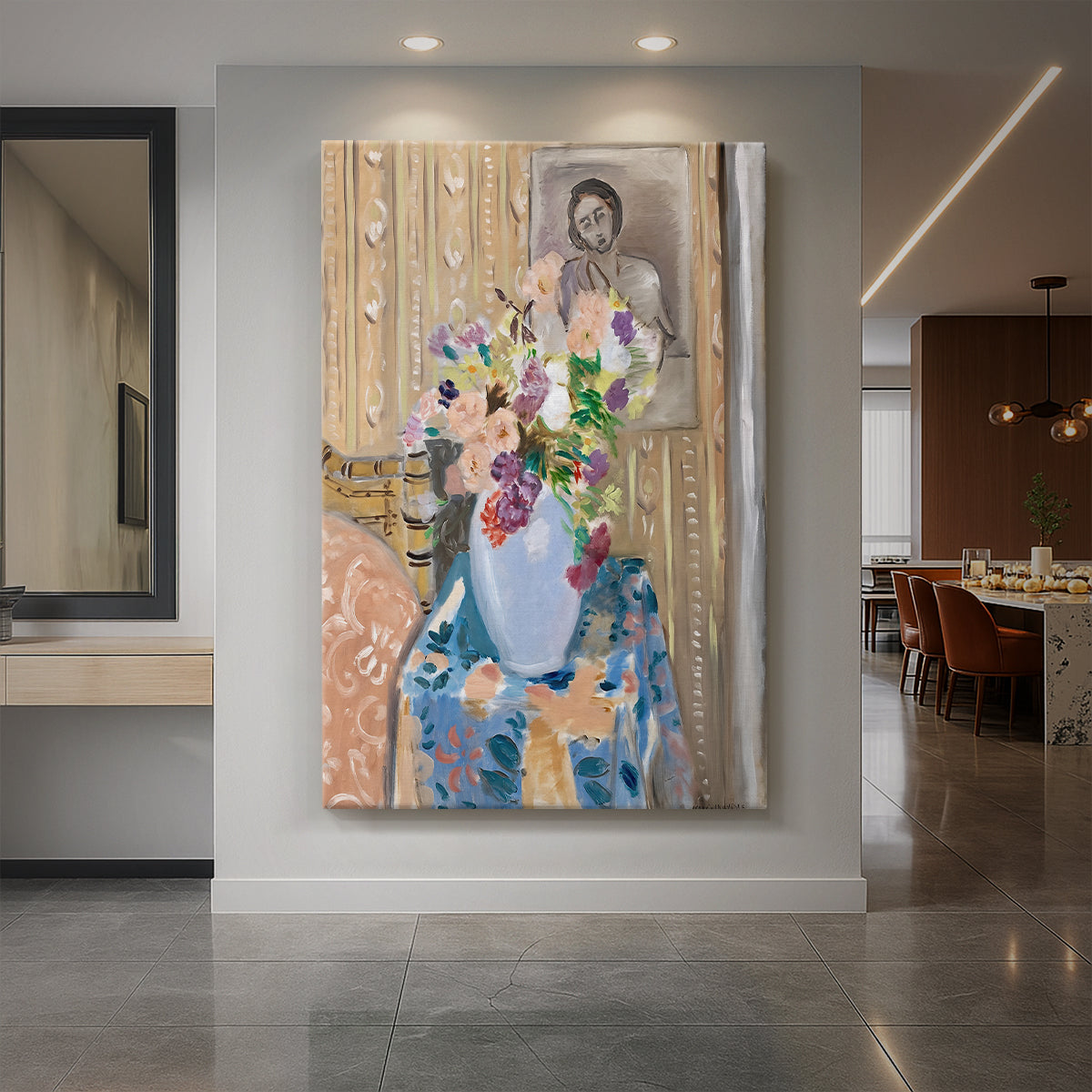 Canvas art print of a fauvist still life of flowers placed before a framed portrait with bold color displayed as a statement piece in a spacious interior.