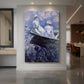Canvas art print of an impressionist scene of girls seated in a rowboat on calm water displayed as a statement piece in a spacious interior.