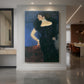 Canvas art print of a realistic portrait of a woman with dark attire and soft lighting displayed as a statement piece in a spacious interior.
