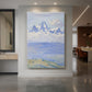 Canvas art print of a tranquil mountain landscape with distant peaks under a soft open sky displayed as a statement piece in a spacious interior.