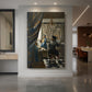 Canvas art print of a Baroque interior of a painter working before a model in soft light displayed as a statement piece in a spacious interior.