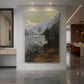Canvas art print of a realistic mountain landscape with a glacier and distant alpine peaks displayed as a statement piece in a spacious interior.
