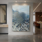 Canvas art print of an impressionist city scene with a busy boulevard and soft atmospheric light displayed as a statement piece in a spacious interior.