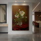 Canvas art print of a still life of white roses in a glass vase with soft natural light displayed as a statement piece in a spacious interior.