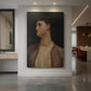 Canvas art print of a classical portrait of a woman with soft light and serene expression displayed as a statement piece in a spacious interior.